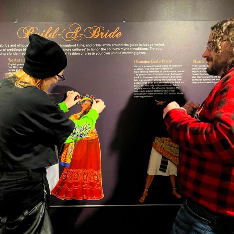 Two guests at Westport Museum's Build a Bride exhibit